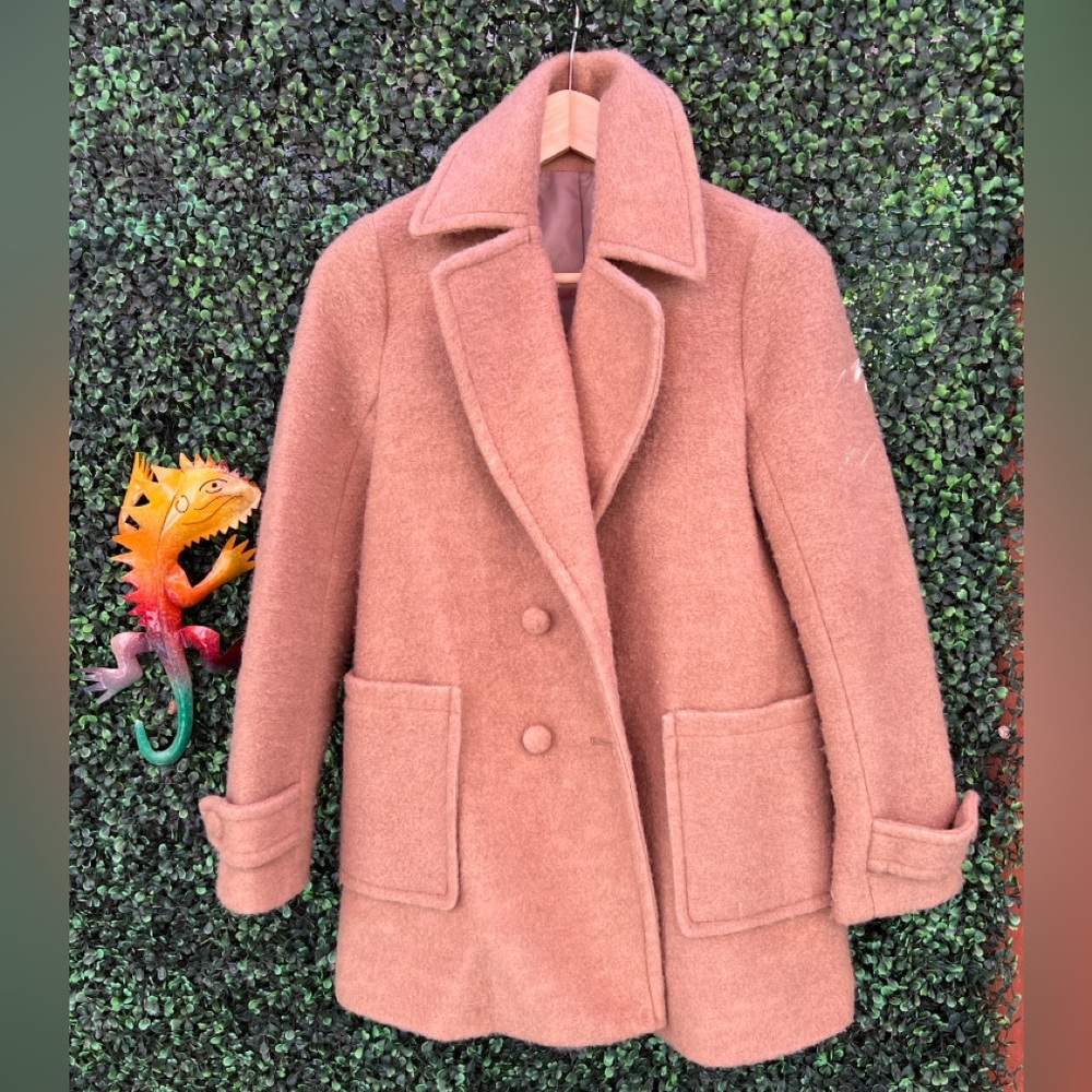 Beat the chill in style with this lightweight wool coat!